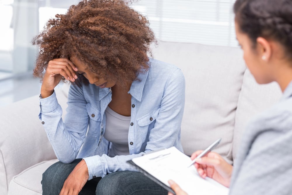 a woman with childhood trauma seeking mental health treatment