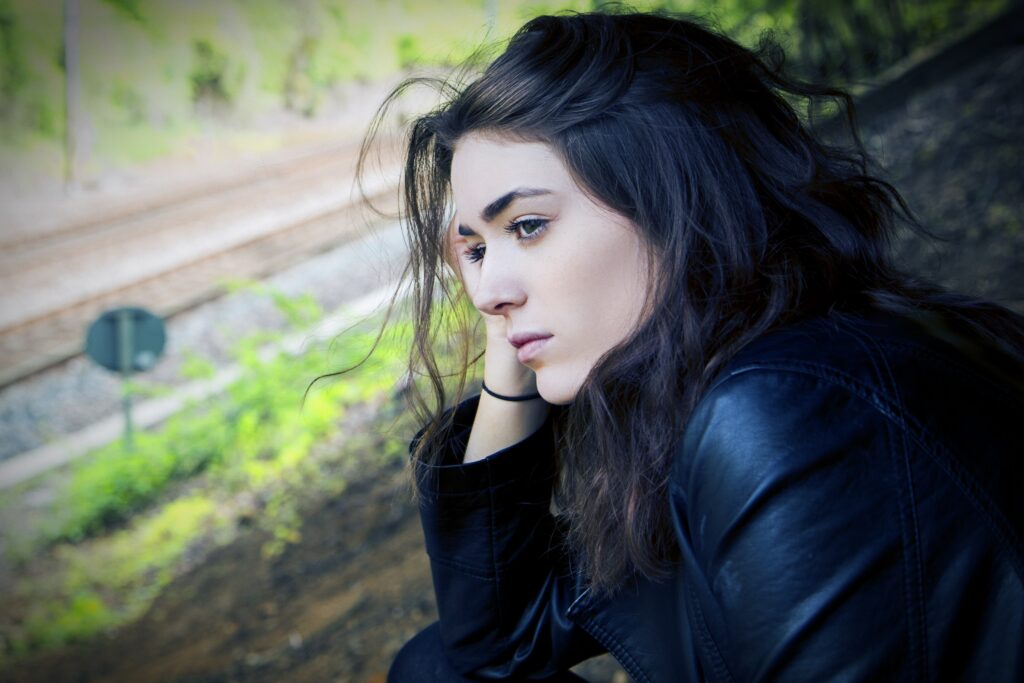 Woman showing PTSD and schizophrenia symptoms