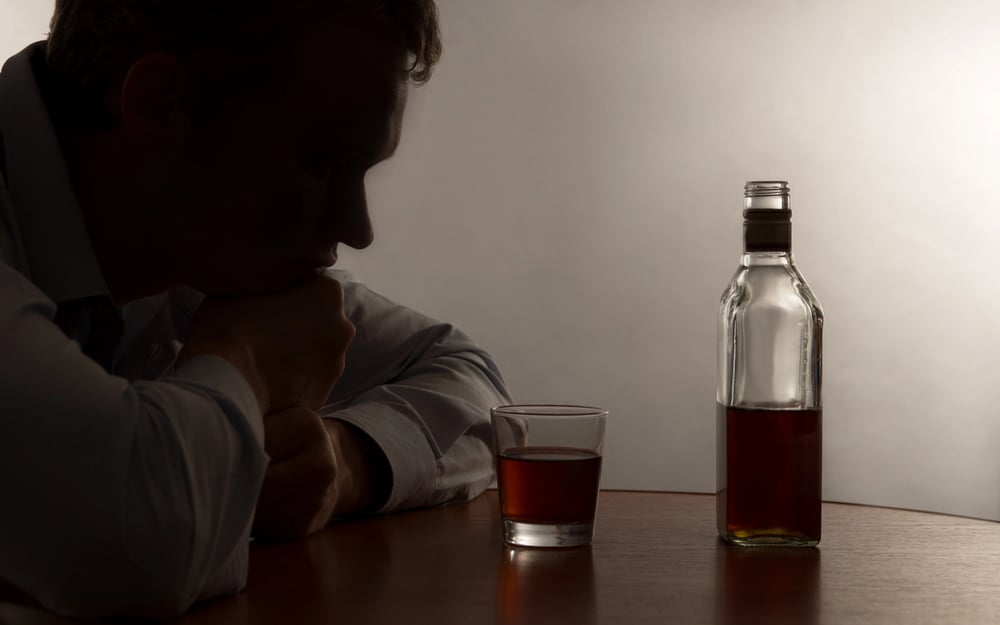 man showing characteristics of an alcoholic
