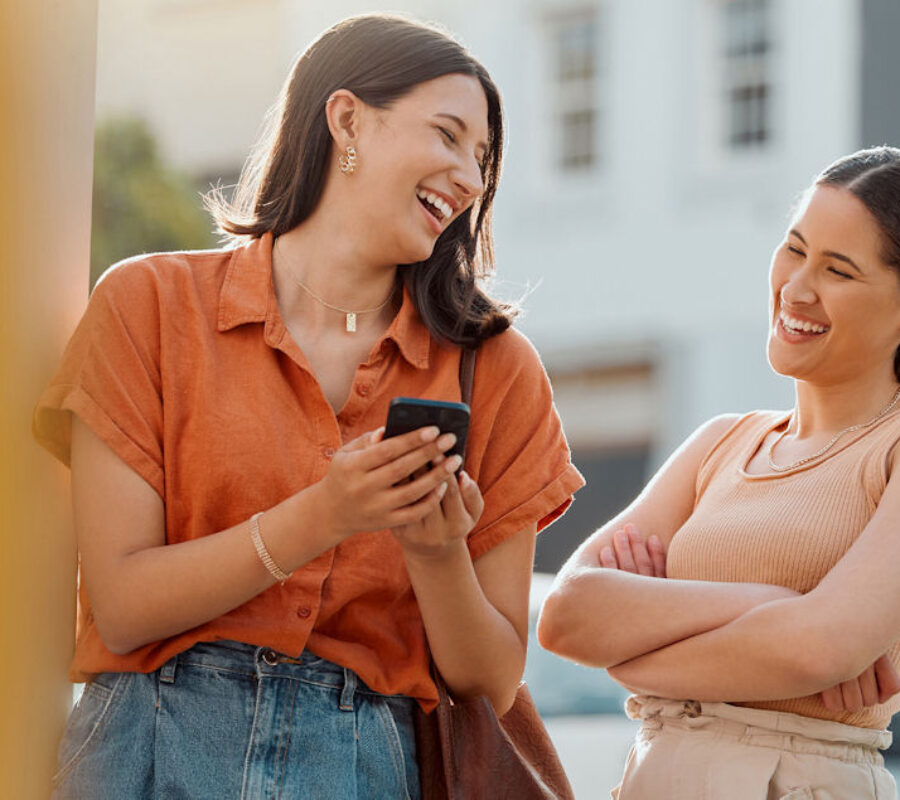 women outside laughing together