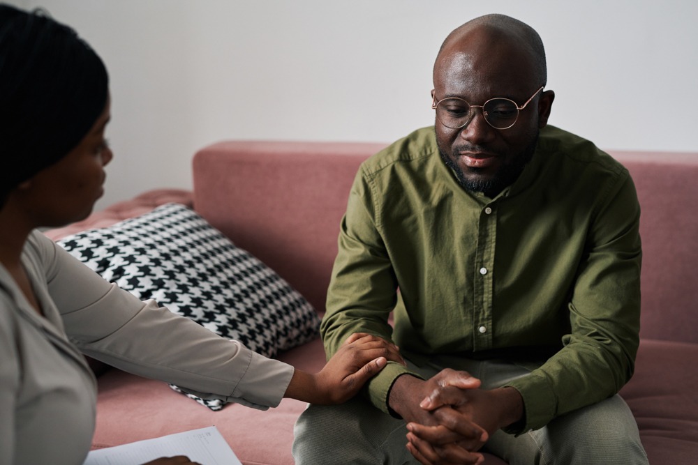 a man suffering from trauma seeking therapy