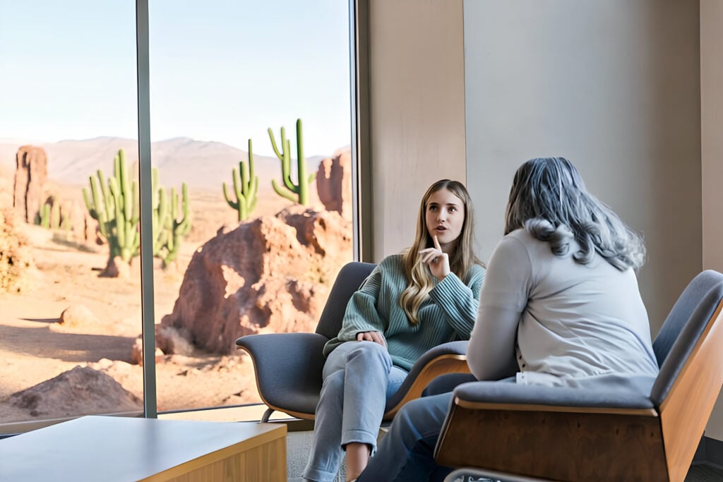 Therapist supporting a client during an individualized trauma therapy session.